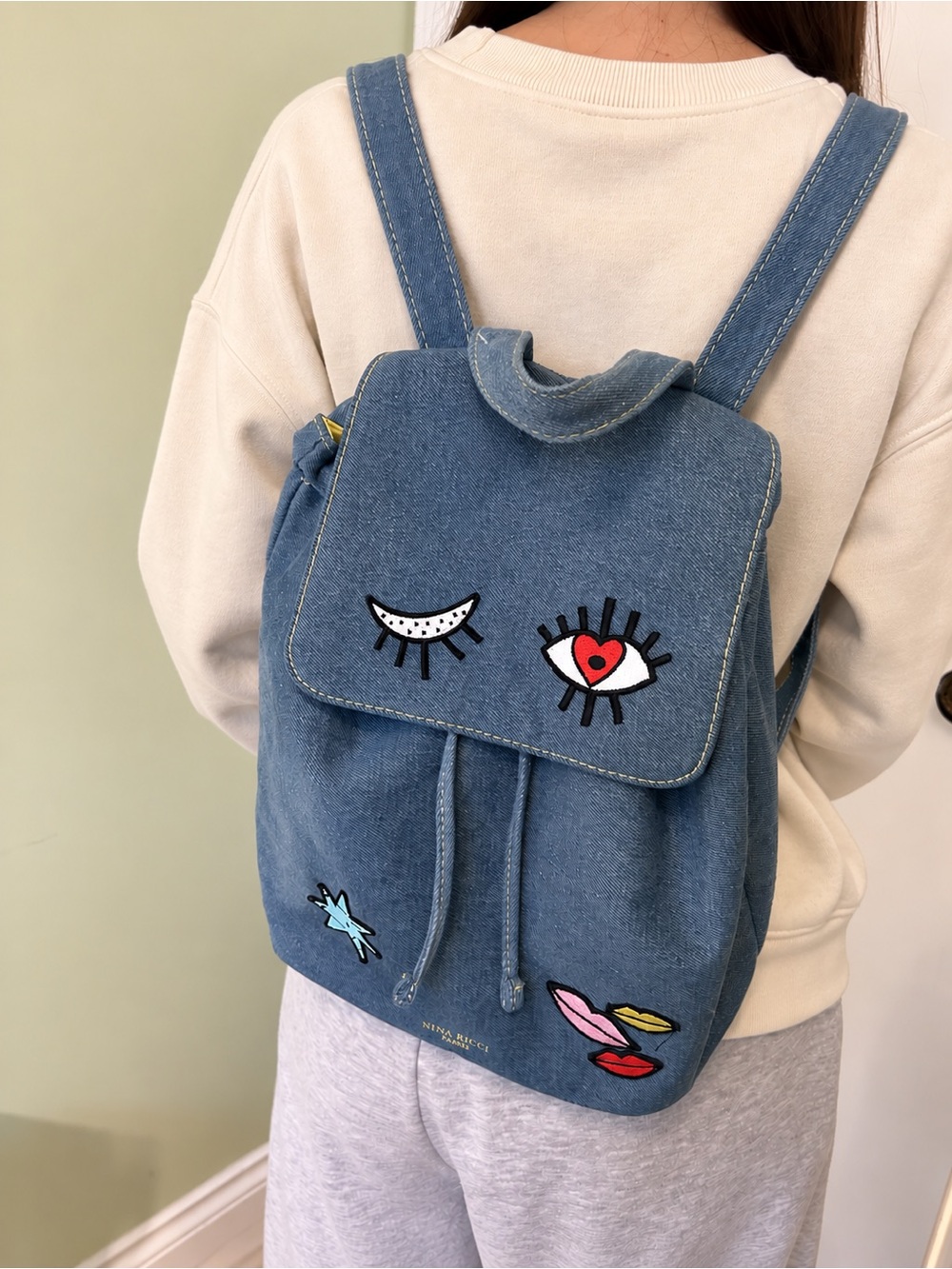 Nina Ricci Parfums Denim Patch Drawstring Backpack - Picture 2 of 5